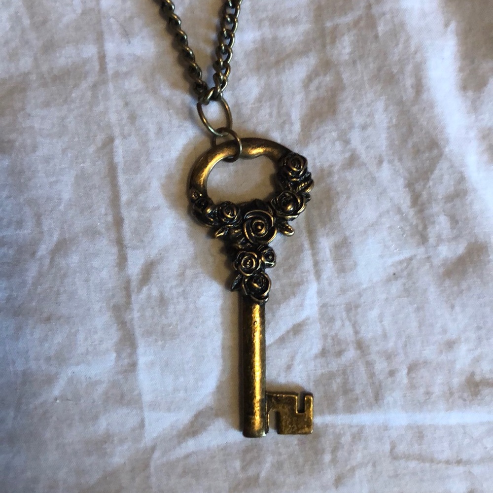 Long copper key necklace.